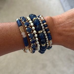 Stacked stretch bracelets.